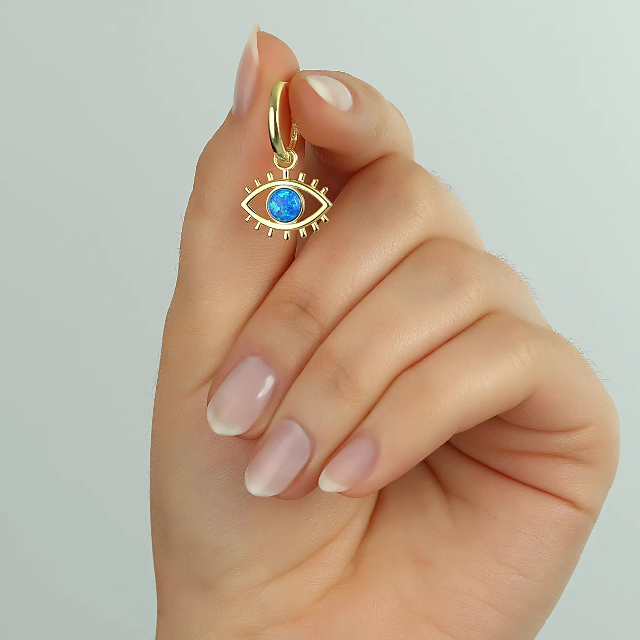 Augen Effekt Ohrringe mit Opal – Schutz trifft auf Eleganz